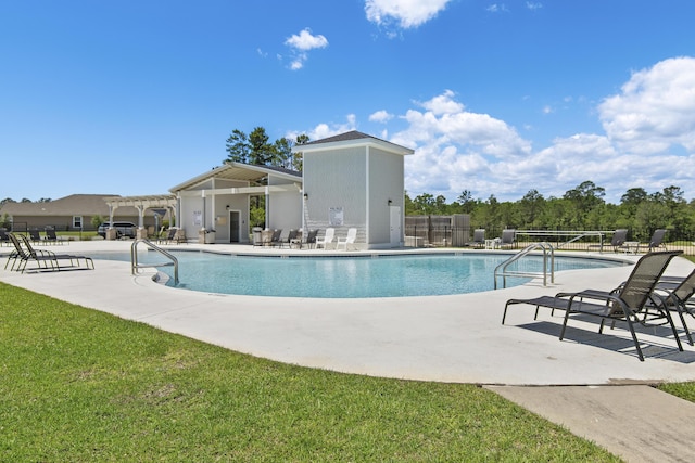 pool featuring fence, a pergola, and a patio