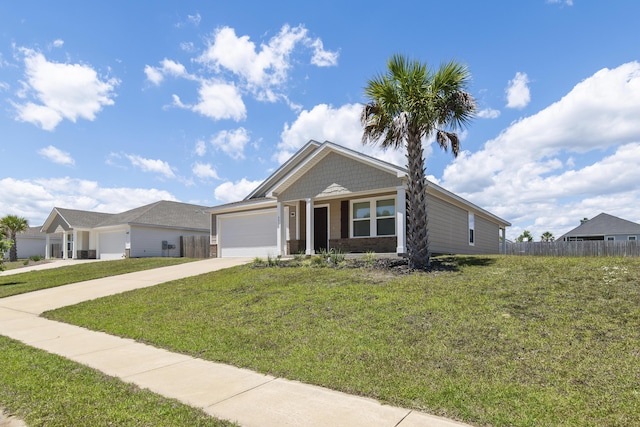 ranch-style house featuring concrete driveway, a front lawn, a garage, and fence