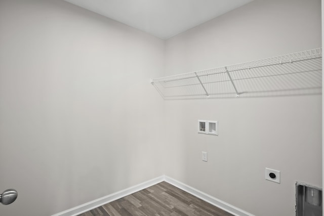 laundry room featuring laundry area, hookup for an electric dryer, dark wood-type flooring, baseboards, and hookup for a washing machine