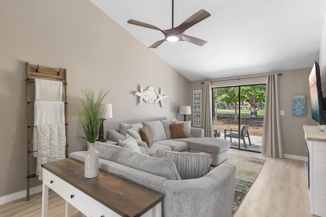 399 Linkside Dr, Miramar Beach, FL 32550 - living room with ceiling fan, lofted ceiling, light wood-style floors, and baseboards