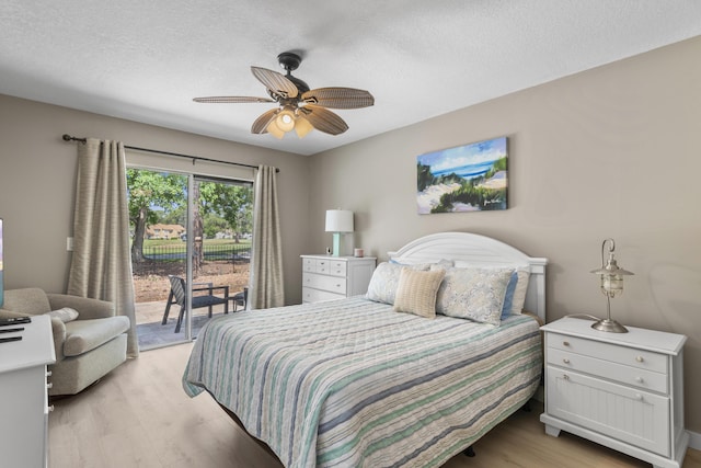 399 Linkside Dr, Miramar Beach, FL 32550 - bedroom featuring access to outside, light wood finished floors, a textured ceiling, and ceiling fan