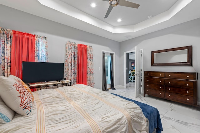 bedroom featuring marble look tile flooring, a raised ceiling, ceiling fan, recessed lighting, and baseboards