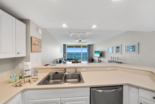 kitchen featuring a sink, light countertops, white cabinetry, and dishwasher