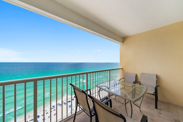 balcony with a view of the beach and a water view