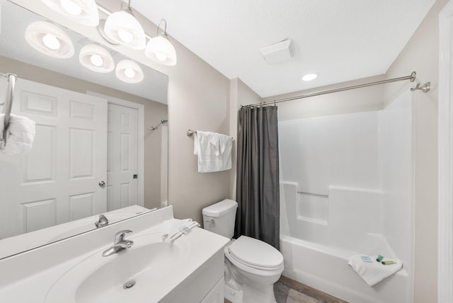 full bathroom featuring toilet, visible vents, shower / tub combo, and vanity