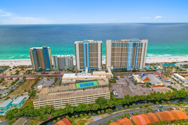 bird's eye view featuring a view of the beach and a water view