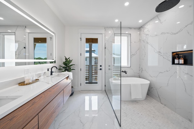 2456 Belmar Ct, Panama City Beach, FL 32408 - bathroom with a freestanding bath, a sink, double vanity, marble finish floor, and recessed lighting