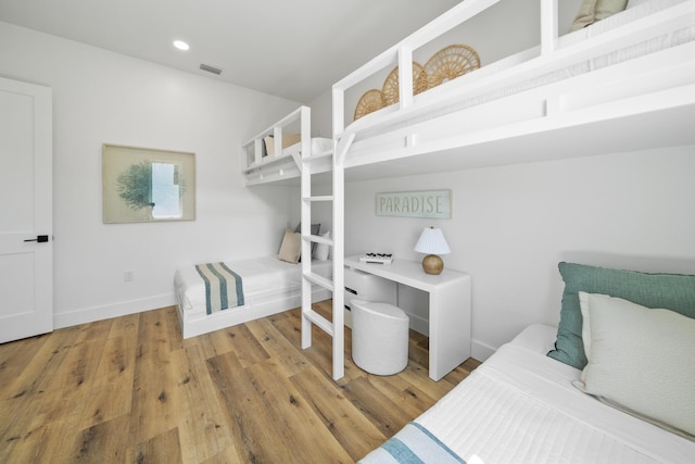 2456 Belmar Ct, Panama City Beach, FL 32408 - bedroom with baseboards, recessed lighting, wood finished floors, and visible vents