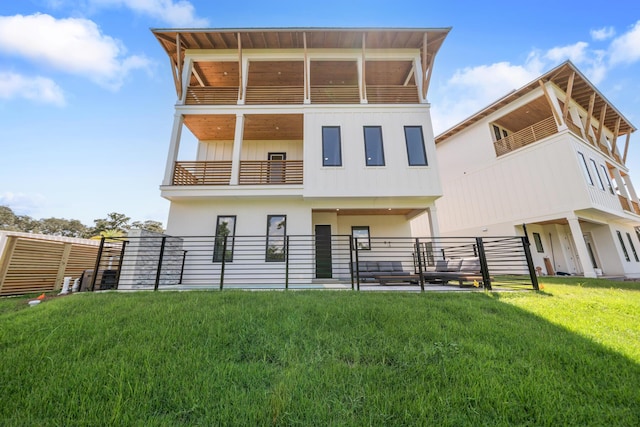2456 Belmar Ct, Panama City Beach, FL 32408 - back of property featuring stucco siding, a yard, and a balcony