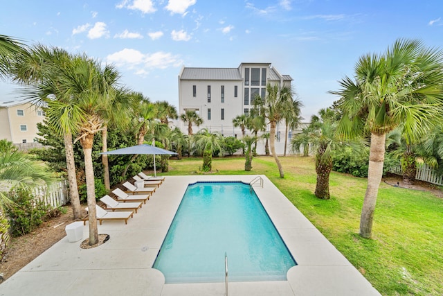 view of swimming pool featuring a yard and a fenced in pool