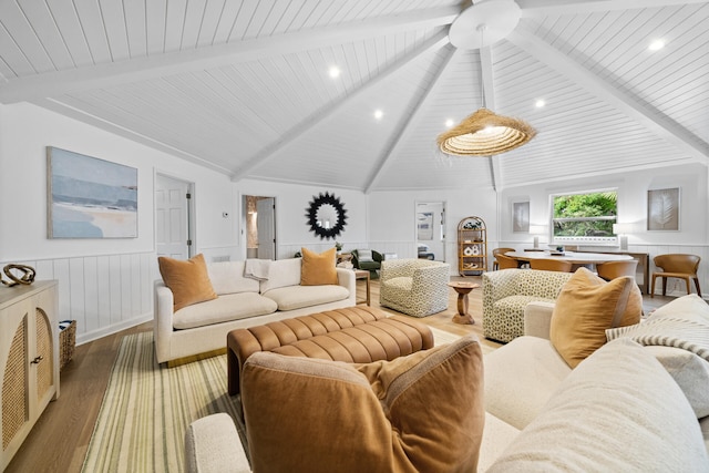 living area featuring vaulted ceiling with beams, wood ceiling, wood finished floors, and wainscoting