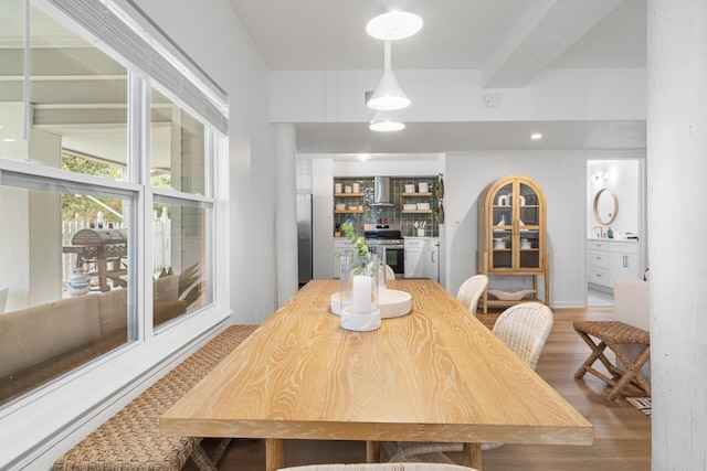 dining area with light wood finished floors