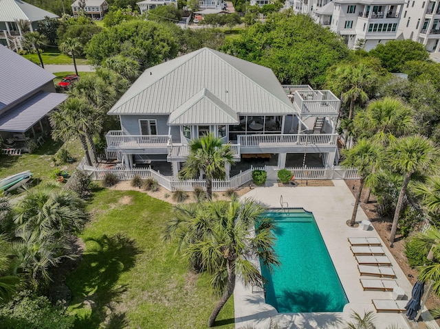 169 Pompano St, Inlet Beach, FL 32461 - back of house featuring metal roof, an outdoor pool, and a patio area