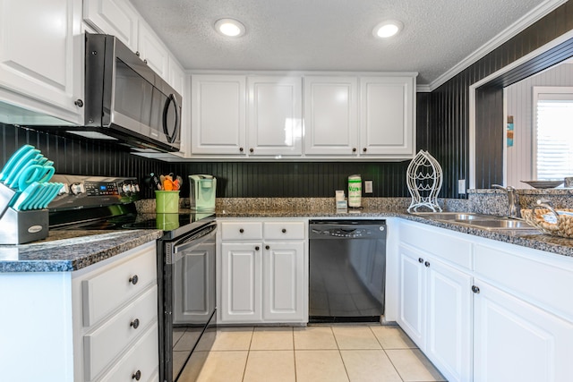 kitchen with a sink, a textured ceiling, black appliances, crown molding, and white cabinets