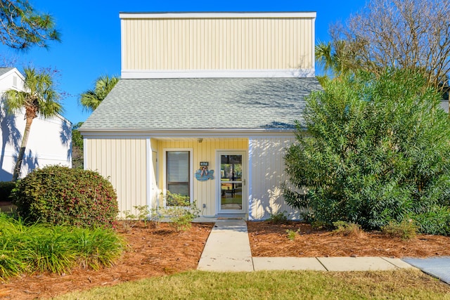 bungalow-style house featuring roof with shingles