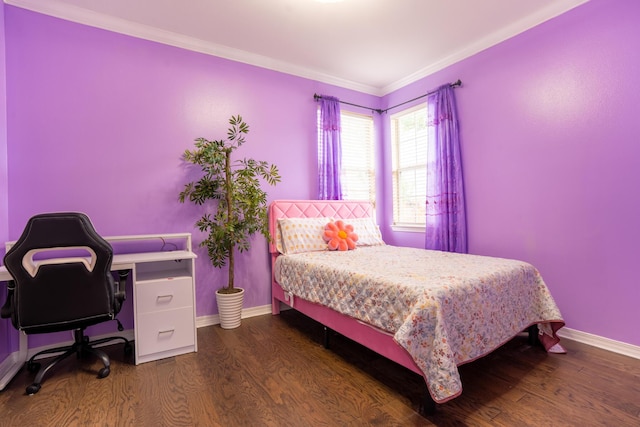 bedroom with crown molding, baseboards, and dark wood finished floors