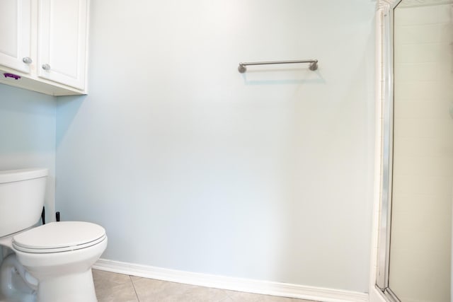 508 Boulder St, Crestview, FL 32536 - bathroom with tile patterned flooring, toilet, a shower stall, and baseboards