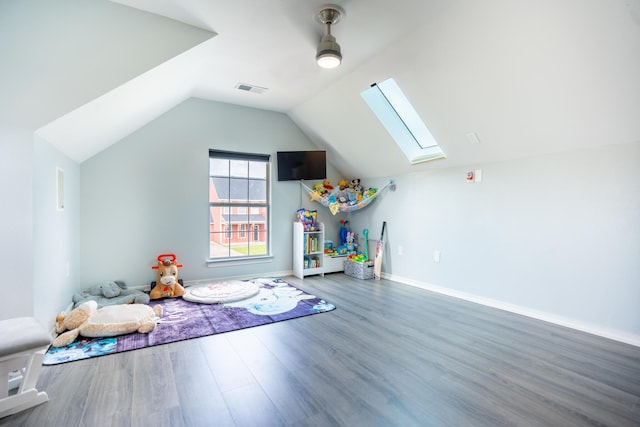 508 Boulder St, Crestview, FL 32536 - playroom with a skylight, wood finished floors, lofted ceiling, and baseboards
