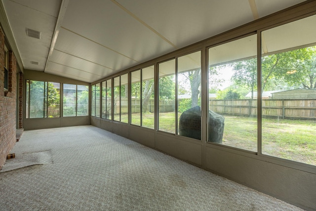 unfurnished sunroom with visible vents