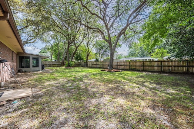 view of yard with a fenced backyard