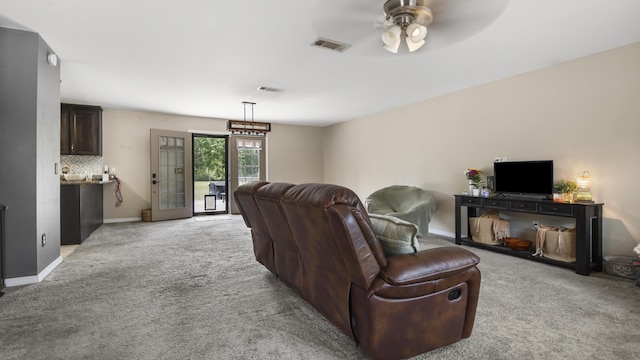 199 W Italian Ave, Defuniak Springs, FL 32433 - living room with light carpet, a ceiling fan, and baseboards