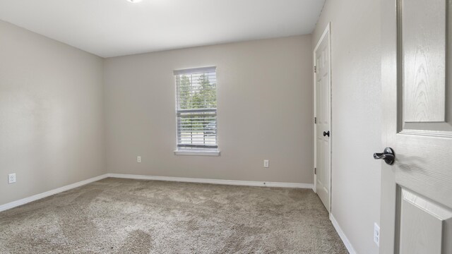 199 W Italian Ave, Defuniak Springs, FL 32433 - spare room with carpet flooring and baseboards