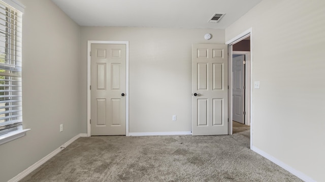 199 W Italian Ave, Defuniak Springs, FL 32433 - unfurnished bedroom with carpet flooring and baseboards