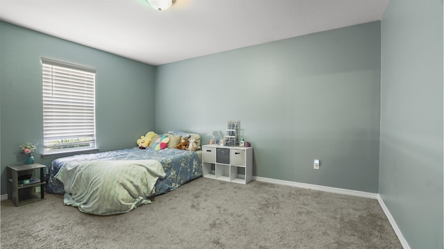 199 W Italian Ave, Defuniak Springs, FL 32433 - bedroom with baseboards and carpet floors