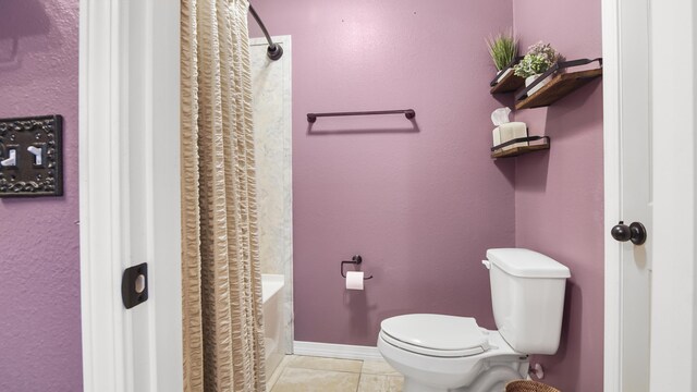 199 W Italian Ave, Defuniak Springs, FL 32433 - full bath featuring toilet, tile patterned flooring, and shower / bath combination with curtain
