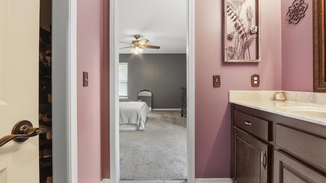 199 W Italian Ave, Defuniak Springs, FL 32433 - bathroom featuring a ceiling fan, vanity, and baseboards