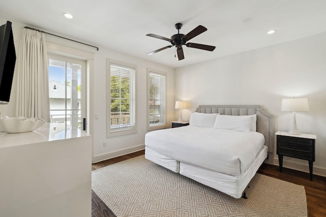 bedroom featuring baseboards, recessed lighting, and wood finished floors