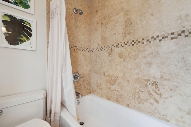 full bathroom featuring toilet and shower / tub combo