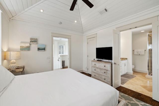 bedroom with visible vents, recessed lighting, ensuite bath, and vaulted ceiling