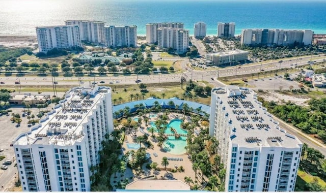 birds eye view of property with a view of city and a water view