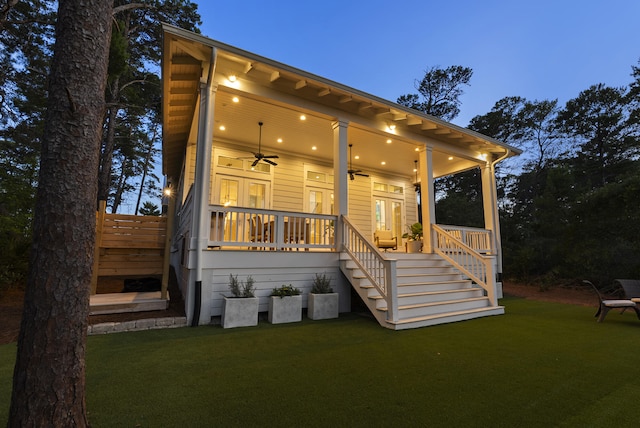 380 N Wall St, Inlet Beach, FL 32461 - rear view of property featuring a ceiling fan, stairway, a lawn, and covered porch