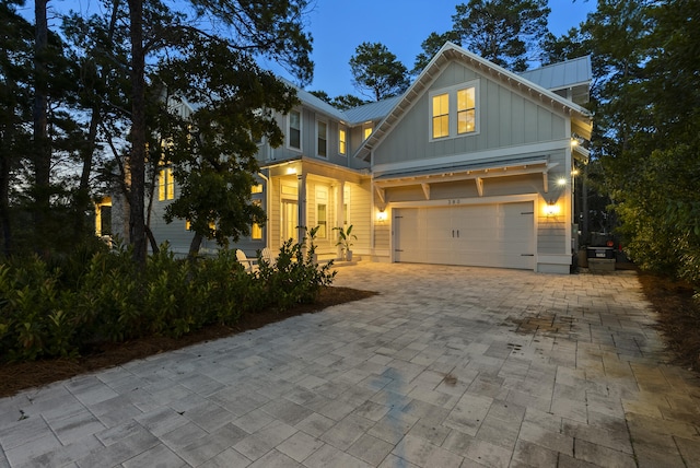 380 N Wall St, Inlet Beach, FL 32461 - view of front of home with board and batten siding, decorative driveway, and metal roof