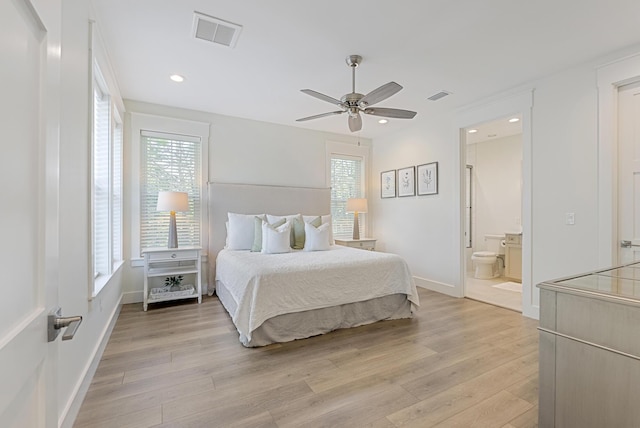 380 N Wall St, Inlet Beach, FL 32461 - bedroom featuring light wood-type flooring, multiple windows, baseboards, ensuite bath, and recessed lighting