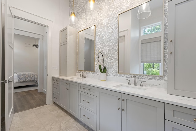 380 N Wall St, Inlet Beach, FL 32461 - full bath with healthy amount of natural light, double vanity, ensuite bathroom, and wallpapered walls