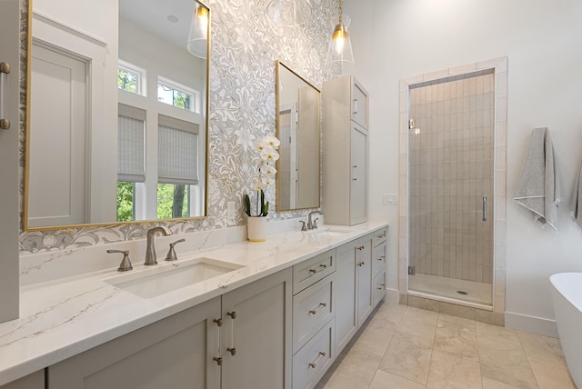 380 N Wall St, Inlet Beach, FL 32461 - bathroom with a stall shower, a soaking tub, double vanity, and baseboards