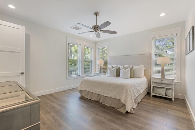 380 N Wall St, Inlet Beach, FL 32461 - bedroom featuring multiple windows, wood finished floors, baseboards, and recessed lighting