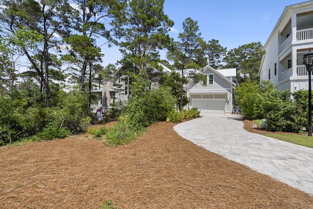 380 N Wall St, Inlet Beach, FL 32461 - view of yard featuring decorative driveway and a garage
