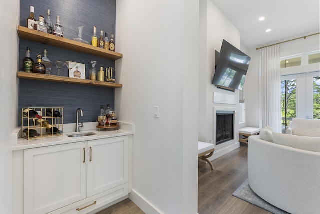 380 N Wall St, Inlet Beach, FL 32461 - indoor wet bar with a fireplace, wood finished floors, recessed lighting, and baseboards