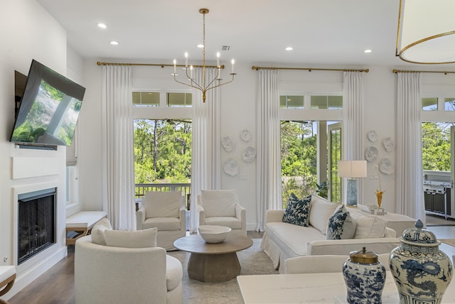 380 N Wall St, Inlet Beach, FL 32461 - living area with recessed lighting, a chandelier, a fireplace, and wood finished floors
