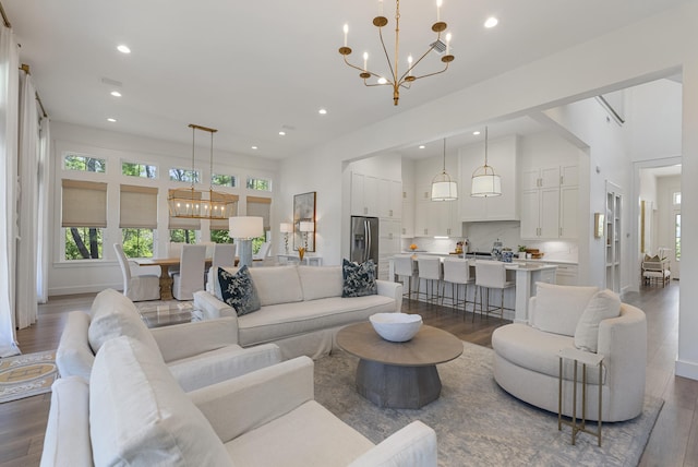 380 N Wall St, Inlet Beach, FL 32461 - living room featuring a chandelier, dark wood-style floors, recessed lighting, and a towering ceiling