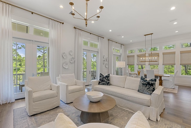 380 N Wall St, Inlet Beach, FL 32461 - living area with a chandelier, french doors, plenty of natural light, wood finished floors, and recessed lighting