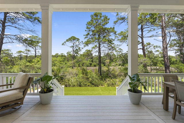 380 N Wall St, Inlet Beach, FL 32461 - deck featuring a lawn and view of scattered trees