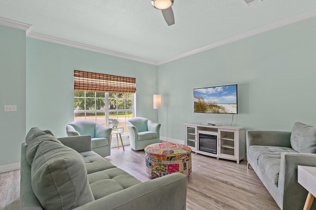 114 Rearden Way, Santa Rosa Beach, FL 32459 - living area with crown molding, a ceiling fan, wood finished floors, and baseboards