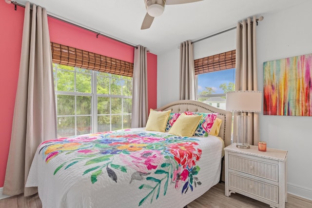 114 Rearden Way, Santa Rosa Beach, FL 32459 - bedroom with wood finished floors, baseboards, and a ceiling fan