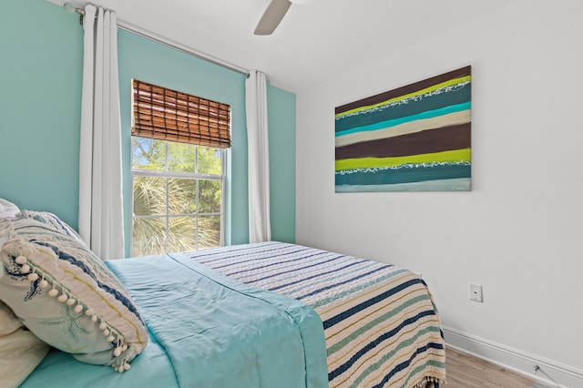 114 Rearden Way, Santa Rosa Beach, FL 32459 - bedroom with wood finished floors, baseboards, and a ceiling fan
