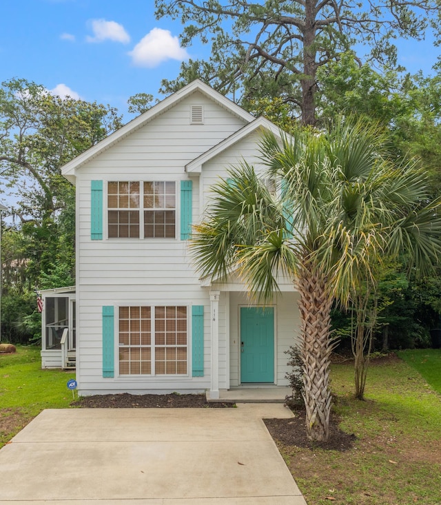 114 Rearden Way, Santa Rosa Beach, FL 32459 - view of front of home featuring a front lawn and a sunroom